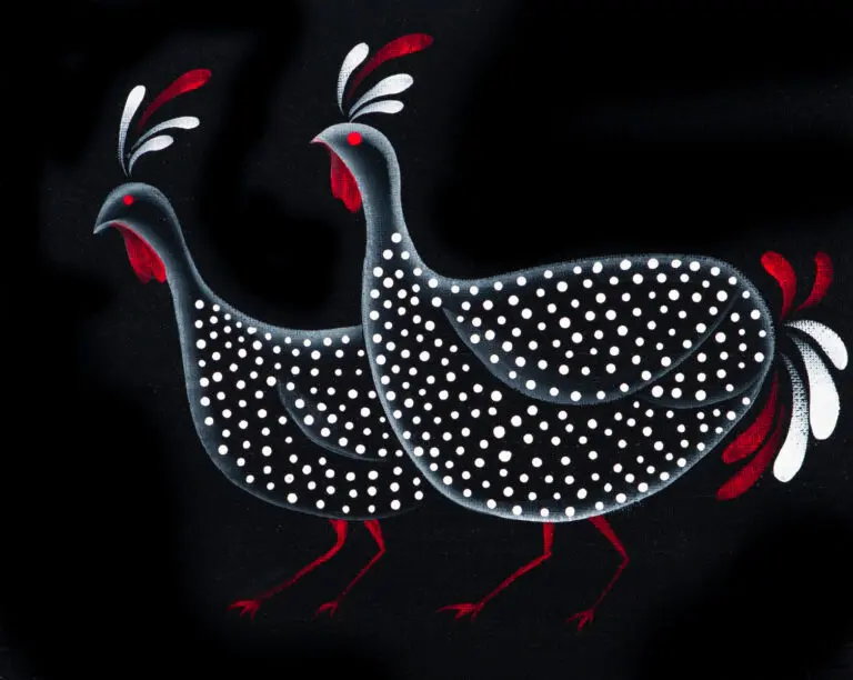 Guinea fowls with red accents and white dots.
